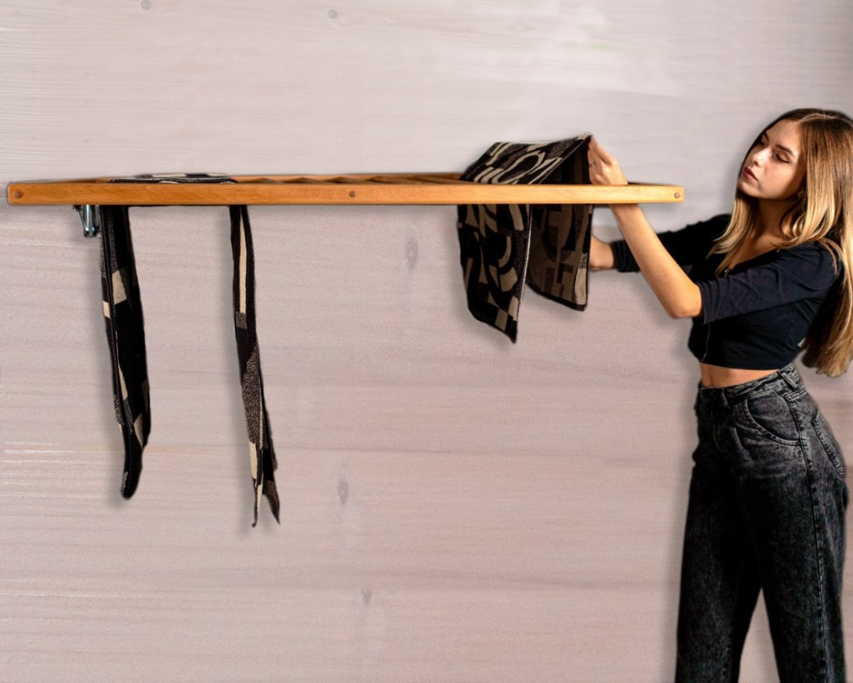 Foldable towel rack for narrow laundry spaces