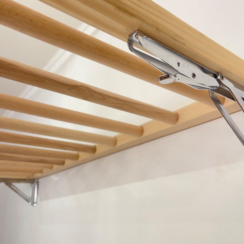 Retractable drying rack with wall hooks and slats
