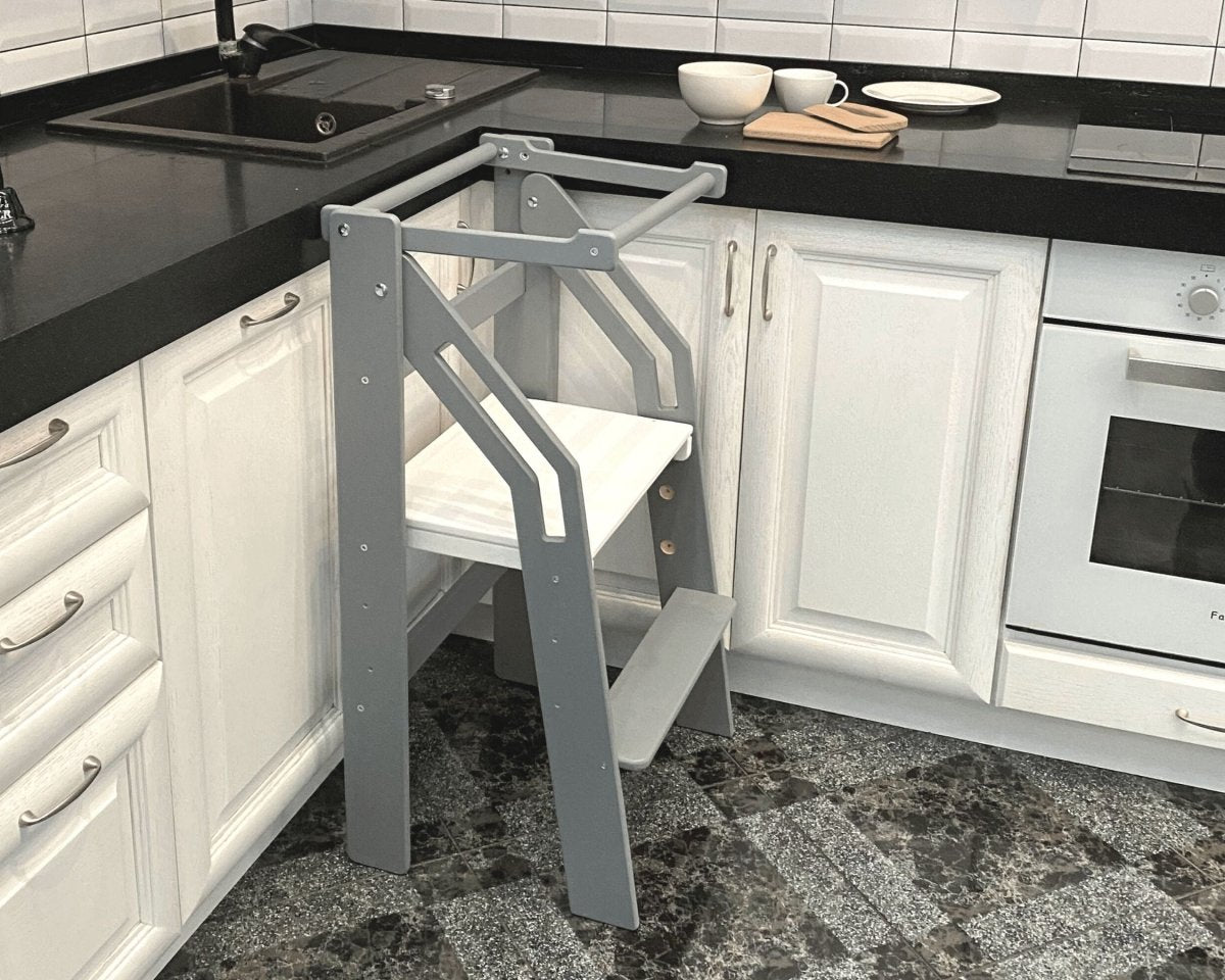 Adjustable toddler kitchen helper tower in modern home