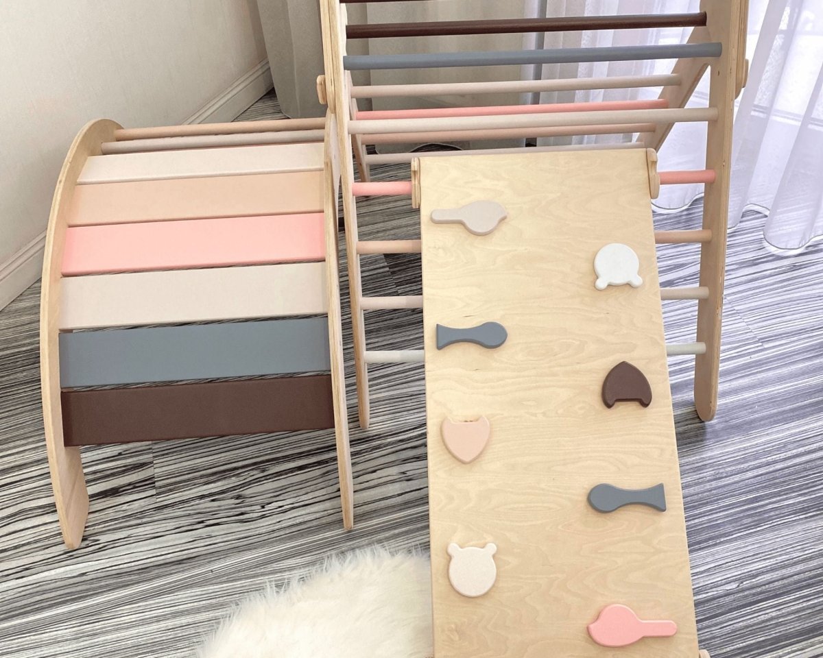 Pikler triangle with arch and slide on play mat